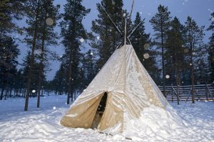 winter camping preparations, teepee in the snow background